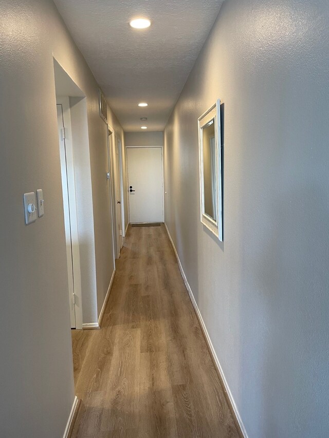 corridor featuring light hardwood / wood-style flooring