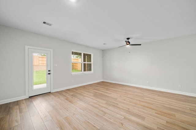 empty room with light hardwood / wood-style flooring and ceiling fan