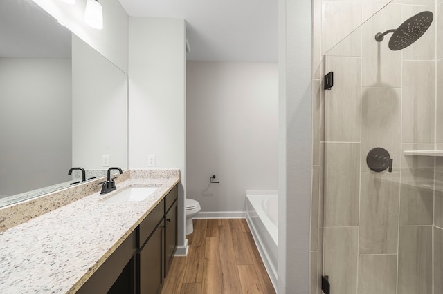 full bathroom featuring vanity, toilet, wood-type flooring, and plus walk in shower