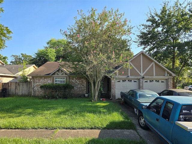 view of front of house featuring a front yard and a garage