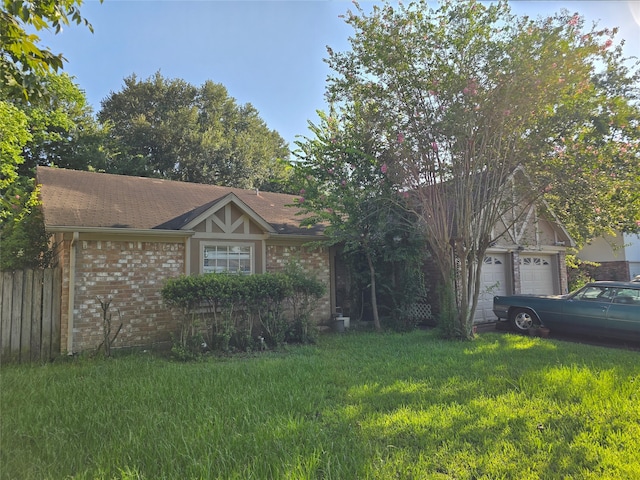 view of front of home featuring a garage and a front lawn