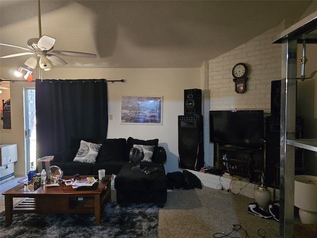 living room featuring ceiling fan and vaulted ceiling