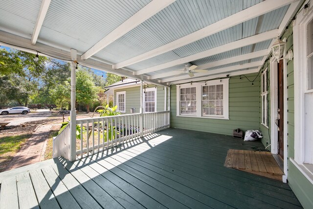 wooden terrace featuring ceiling fan