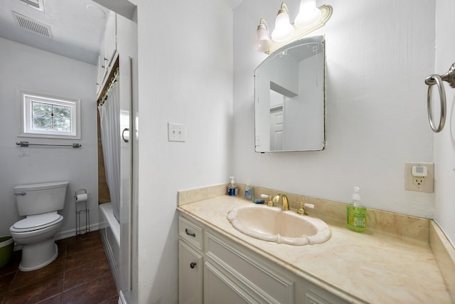 full bathroom with toilet, shower / bath combo with shower curtain, vanity, and tile patterned flooring