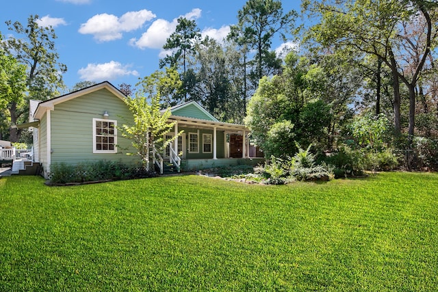 back of property featuring a lawn