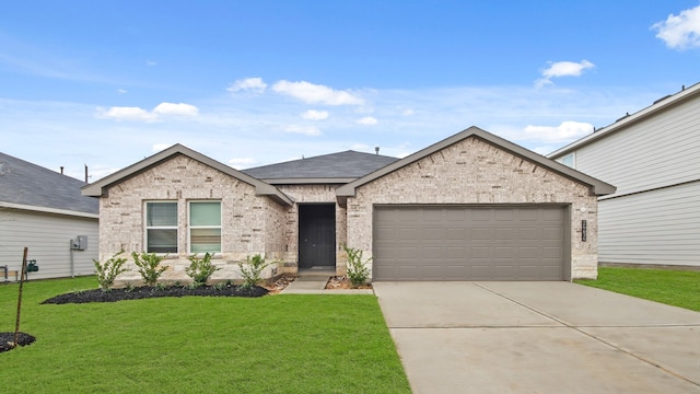 view of front of property with a garage and a front yard