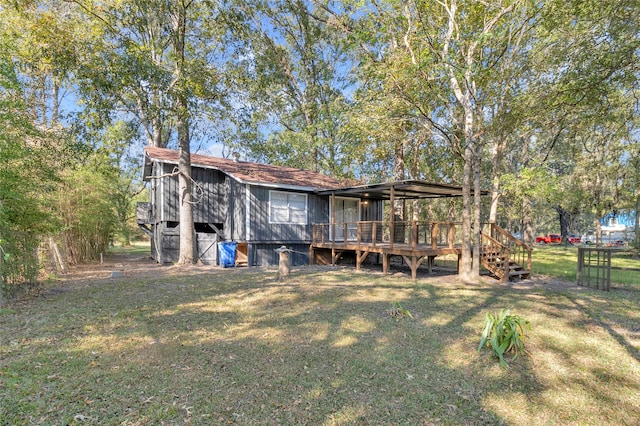 back of house with a yard and a wooden deck