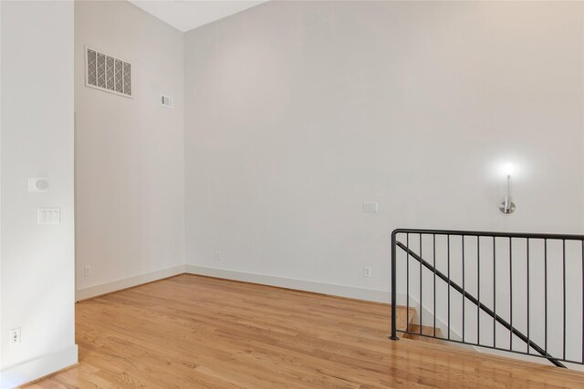 spare room with light hardwood / wood-style flooring