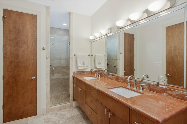 bathroom featuring vanity and a shower with shower door