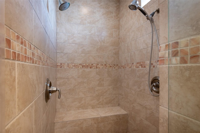 bathroom with tiled shower