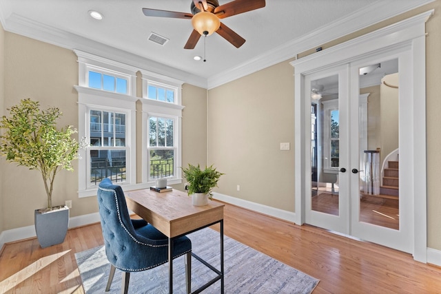 office featuring ornamental molding, ceiling fan, light hardwood / wood-style floors, and french doors