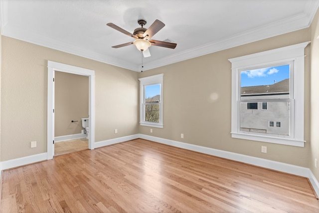 interior space with ceiling fan, ornamental molding, ensuite bathroom, and light wood-type flooring