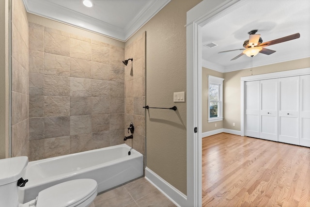 501 Cordell St, Houston, TX 77009 - full bathroom featuring crown molding, toilet, tub / shower combination, ceiling fan, and baseboards