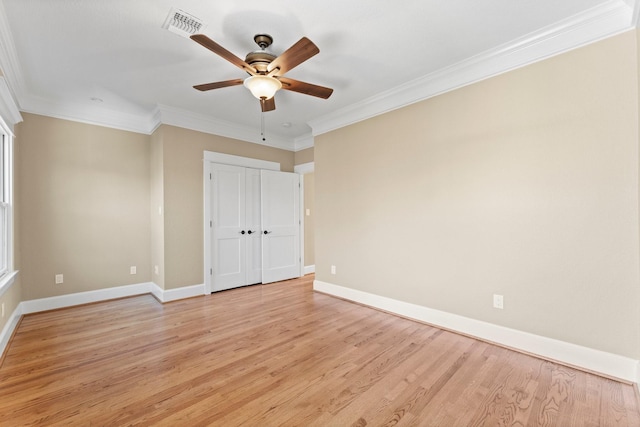 501 Cordell St, Houston, TX 77009 - unfurnished bedroom with light wood-style flooring, ornamental molding, baseboards, a ceiling fan, and a closet
