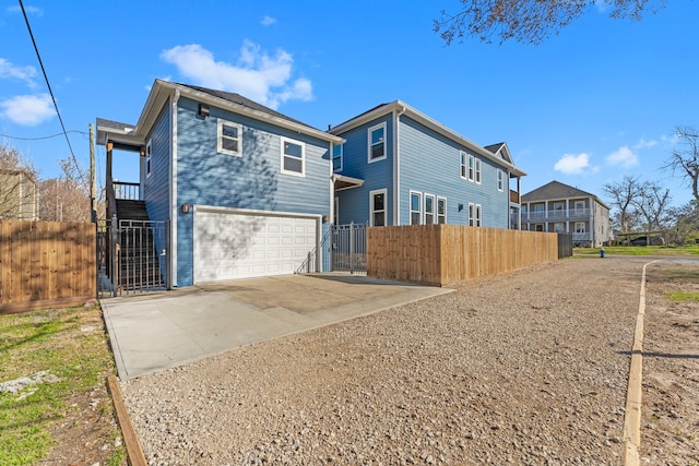 back of property with a garage