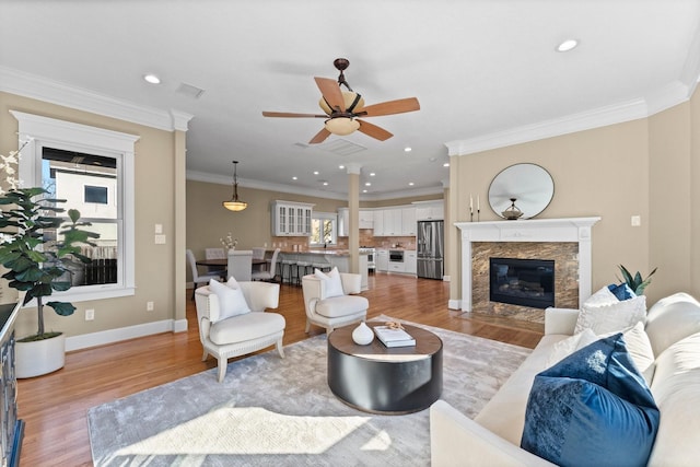 501 Cordell St, Houston, TX 77009 - living area with a ceiling fan, a healthy amount of sunlight, light wood finished floors, and visible vents