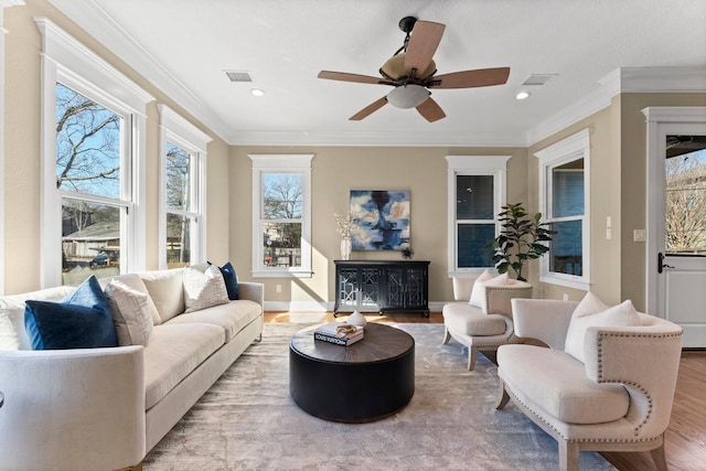 501 Cordell St, Houston, TX 77009 - living area with plenty of natural light, visible vents, wood finished floors, and a ceiling fan