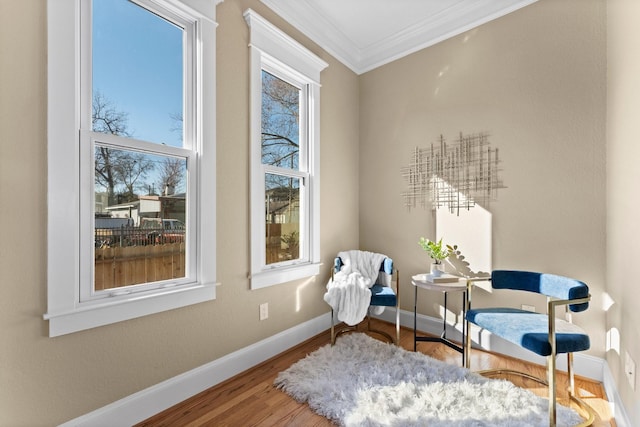 501 Cordell St, Houston, TX 77009 - living area featuring ornamental molding, baseboards, and wood finished floors
