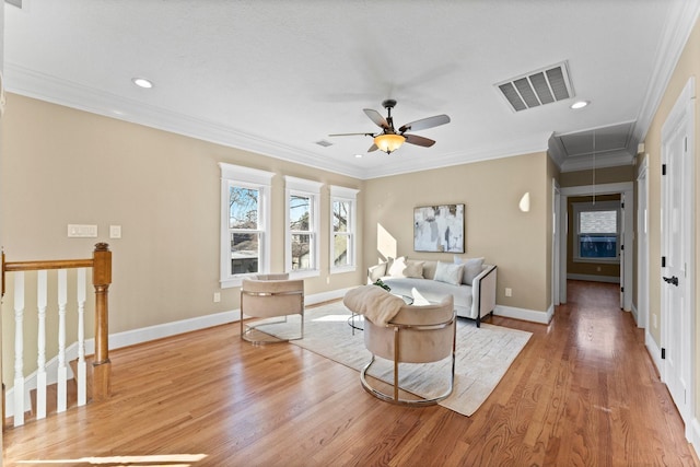 501 Cordell St, Houston, TX 77009 - living area featuring attic access, light wood finished floors, baseboards, ornamental molding, and ceiling fan