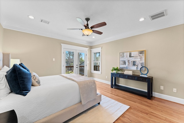 bedroom with access to outside, ceiling fan, crown molding, light wood-type flooring, and french doors