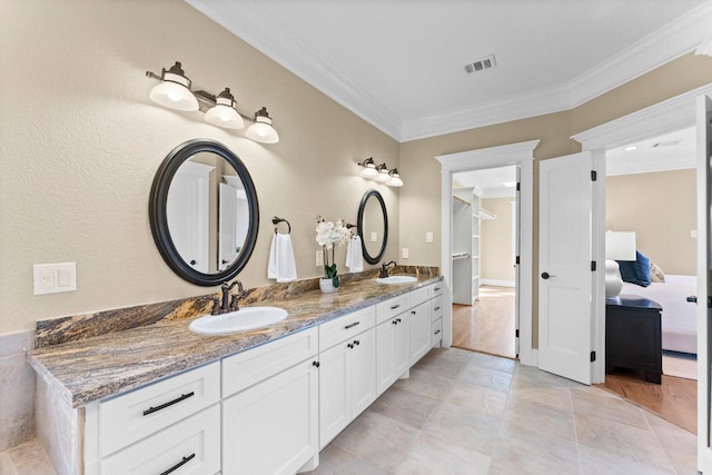 501 Cordell St, Houston, TX 77009 - ensuite bathroom featuring ornamental molding, visible vents, a sink, and double vanity