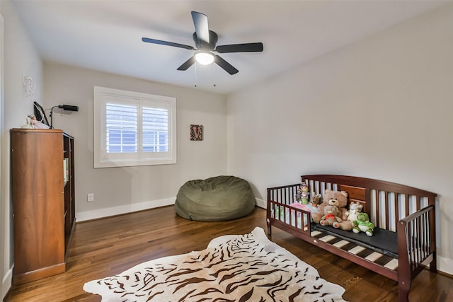 bedroom featuring dark wood-type flooring and ceiling fan