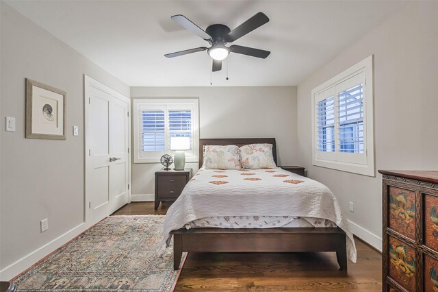 bedroom featuring dark wood-type flooring and ceiling fan