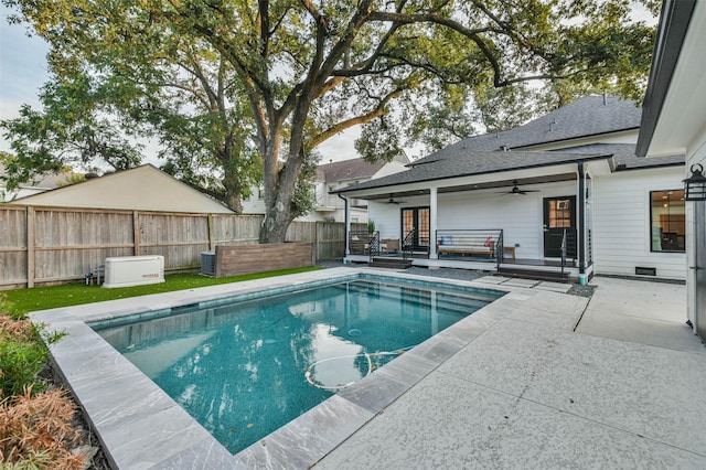 view of pool with ceiling fan and a patio