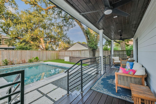 view of swimming pool with an outdoor hangout area and ceiling fan