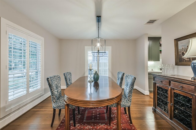 dining space featuring dark hardwood / wood-style flooring