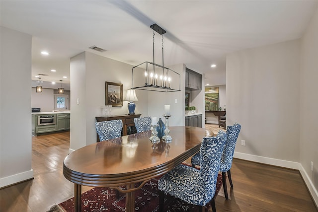 dining area featuring wood-type flooring