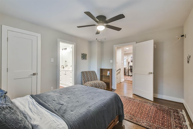 bedroom featuring wood-type flooring, connected bathroom, and ceiling fan