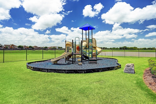 view of jungle gym with a lawn