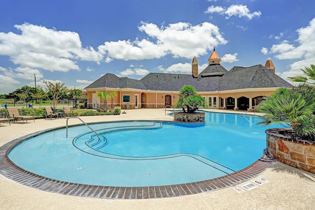 view of swimming pool featuring a patio