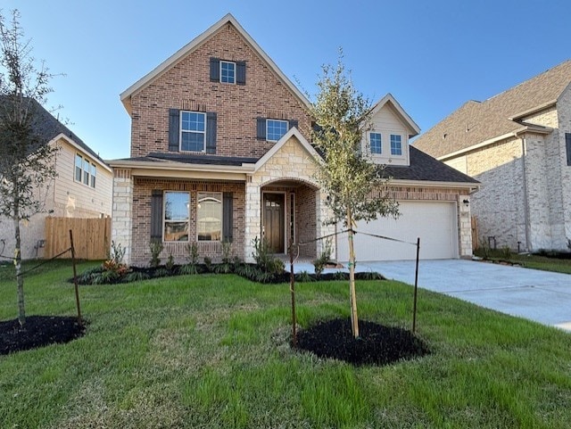 view of front of house featuring a front lawn and a garage