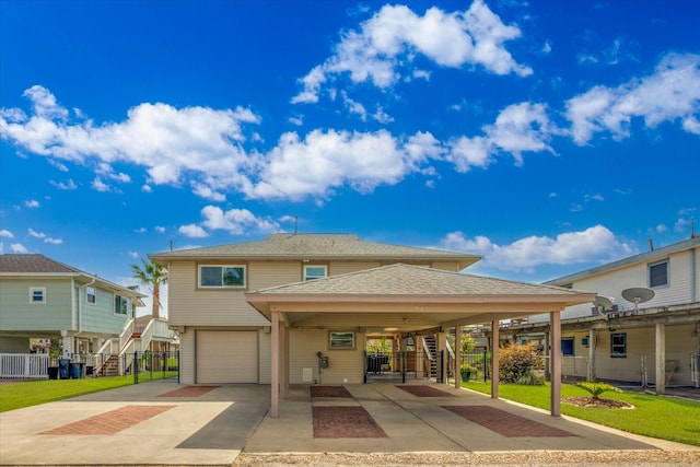 view of front of home featuring driveway, a carport, stairs, roof with shingles, and a garage