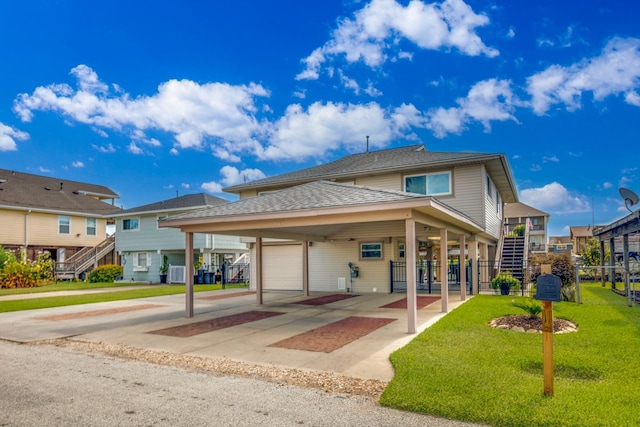 view of front of house featuring central AC and a front lawn