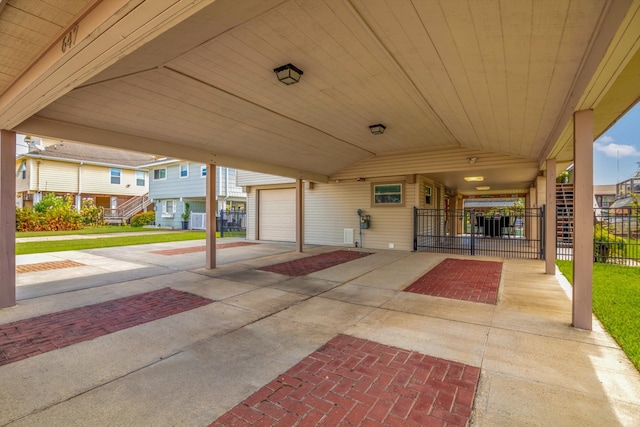 view of patio with central air condition unit, a garage, and a carport