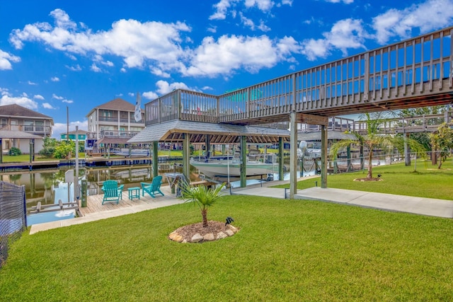 view of dock featuring a water view and a lawn