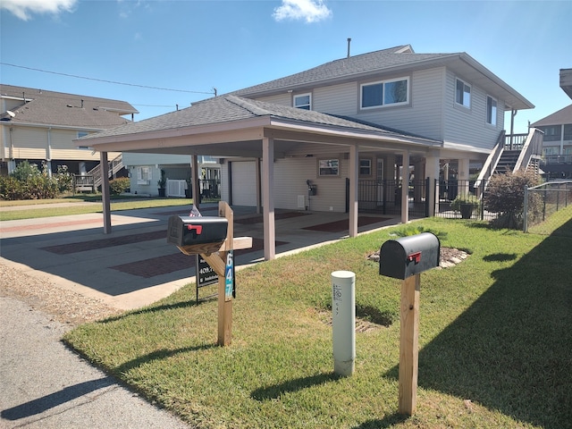 exterior space featuring cooling unit and a front yard