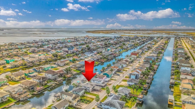 birds eye view of property featuring a water view and a residential view