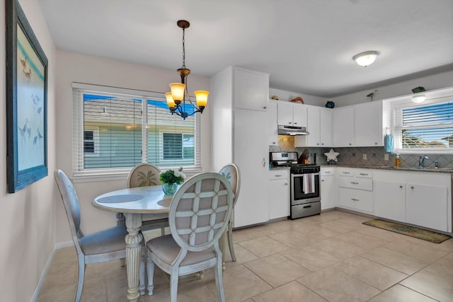 kitchen featuring white cabinetry, tasteful backsplash, electric range, and decorative light fixtures