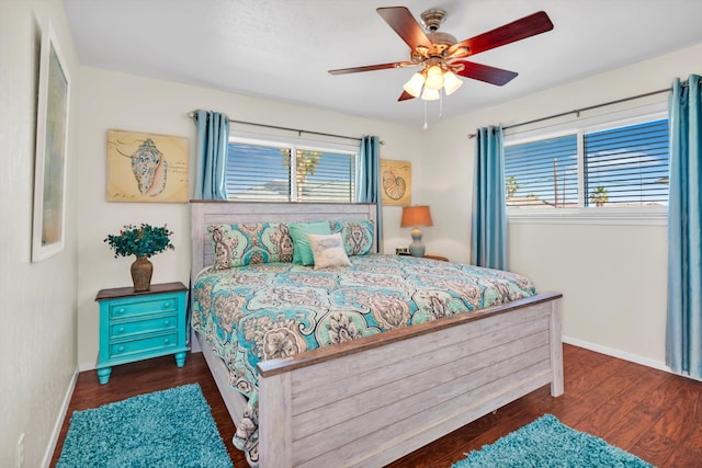 bedroom featuring ceiling fan and dark hardwood / wood-style flooring