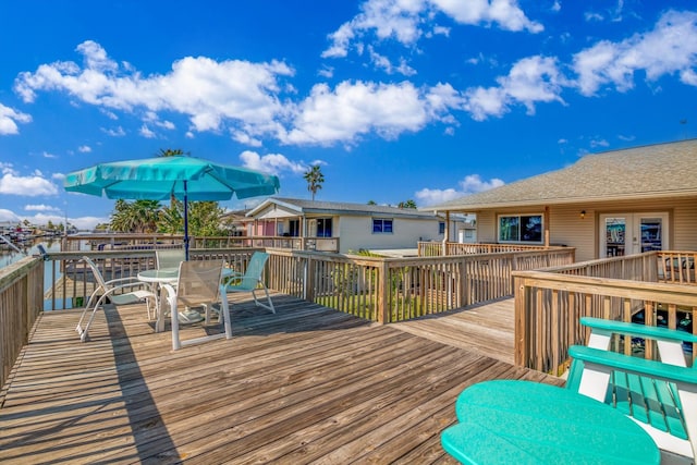 wooden terrace with a water view