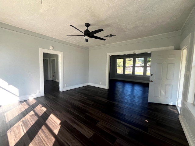 empty room with a textured ceiling, ceiling fan, and dark hardwood / wood-style flooring