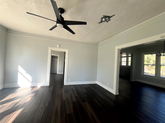 unfurnished room featuring crown molding, a textured ceiling, dark hardwood / wood-style floors, and ceiling fan