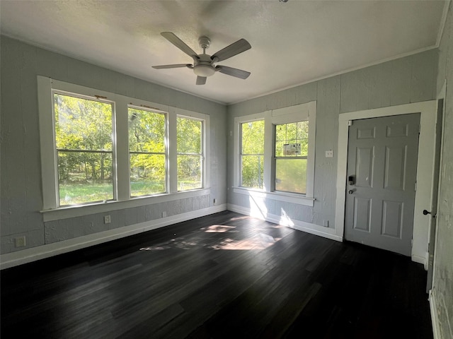 interior space with ceiling fan