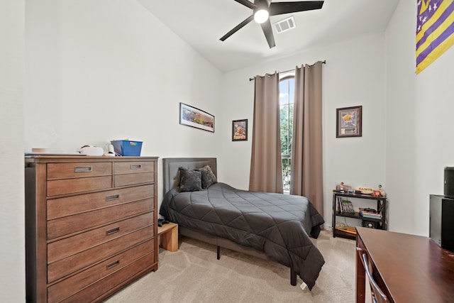 bedroom featuring lofted ceiling, light carpet, and ceiling fan