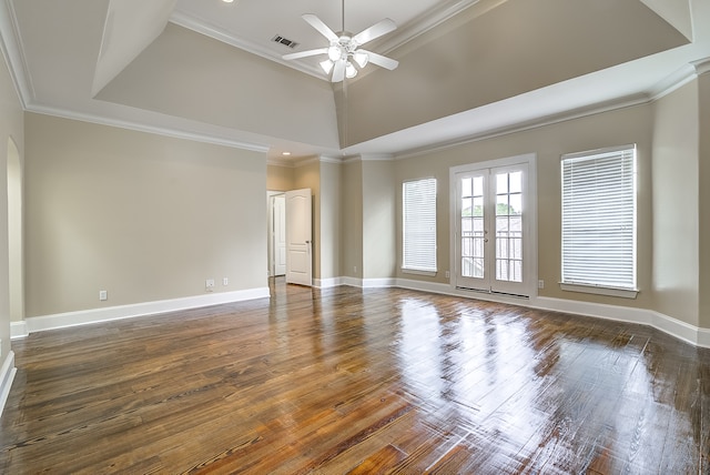 spare room with ornamental molding, french doors, dark hardwood / wood-style floors, and ceiling fan