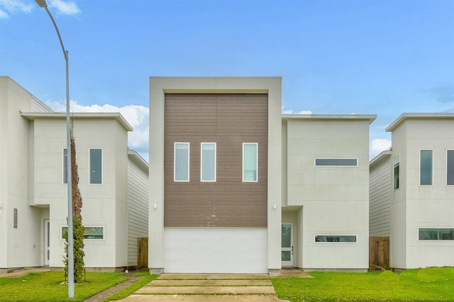 modern home with a front lawn